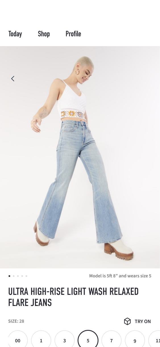 Relaxed flare-jeans product screen with model photography, size choices and a Try On control.