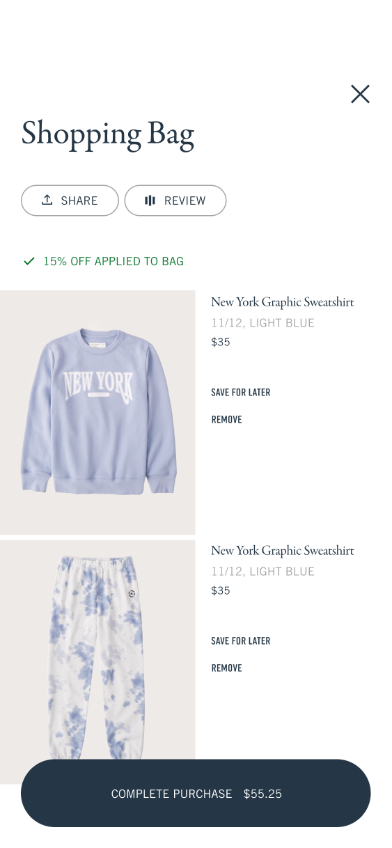 Shopping bag containing the sweatshirt and sweatpants with the promotional discount applied.